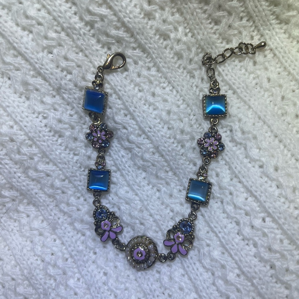 Vintage bracelet with multiple linked segments with decorative elements